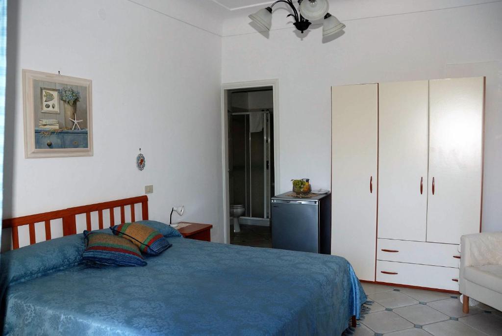 Łóżko lub łóżka w pokoju w obiekcie villa damecuta B&B