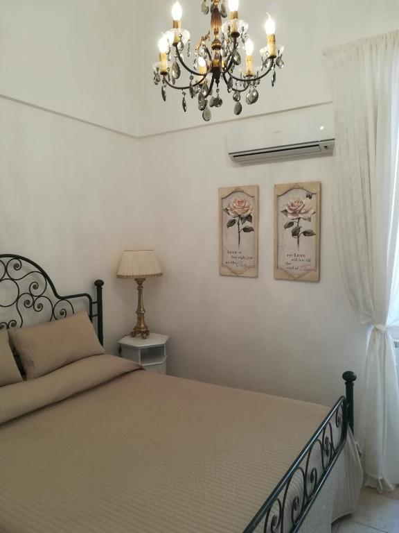 Postel nebo postele na pokoji v ubytování Resort Romano in Trulli