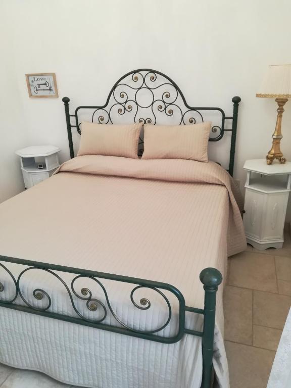 Postel nebo postele na pokoji v ubytování Resort Romano in Trulli