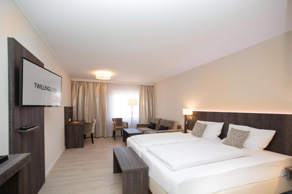 Postel nebo postele na pokoji v ubytování Hotel Twilling