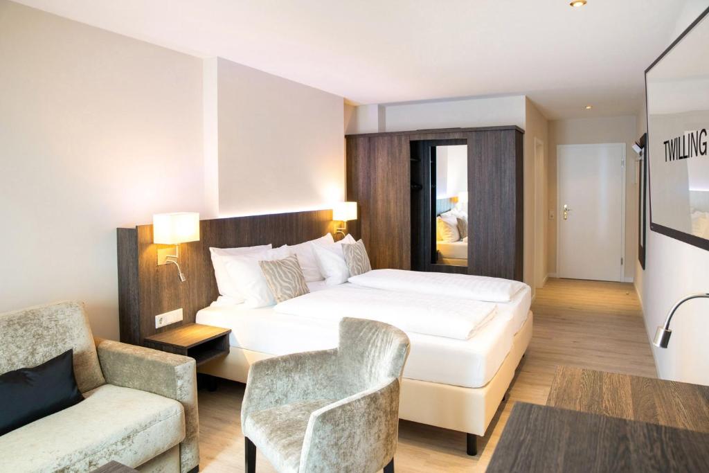 Postel nebo postele na pokoji v ubytování Hotel Twilling