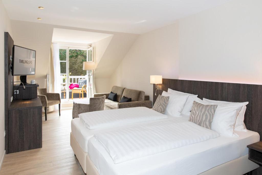 Postel nebo postele na pokoji v ubytování Hotel Twilling