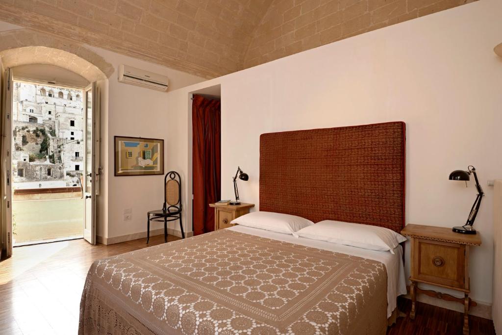 Una cama o camas en una habitación de Fra I Sassi Residence