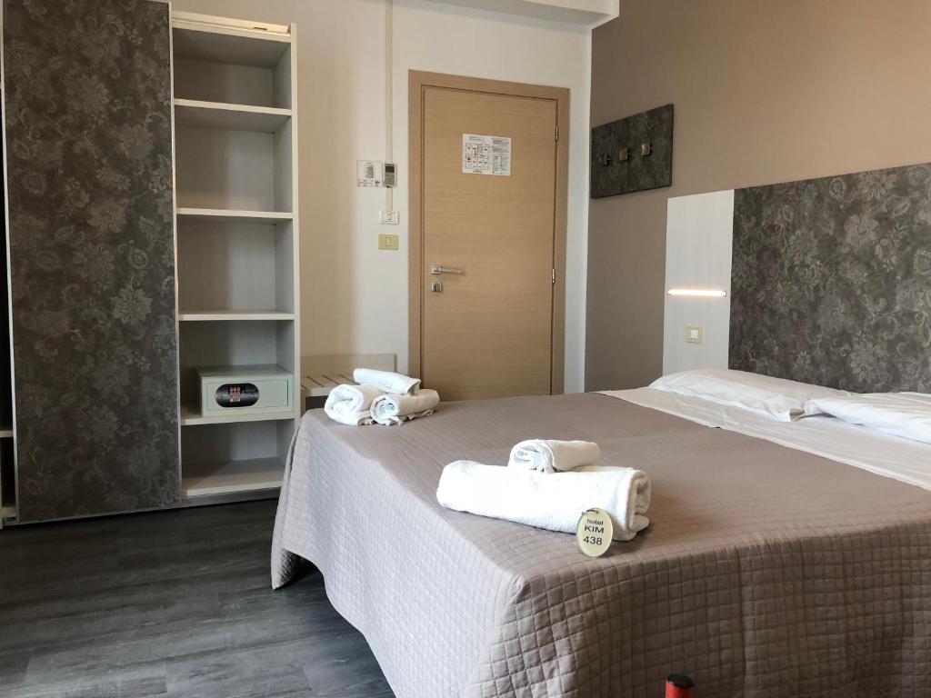 Postel nebo postele na pokoji v ubytování Hotel Kim
