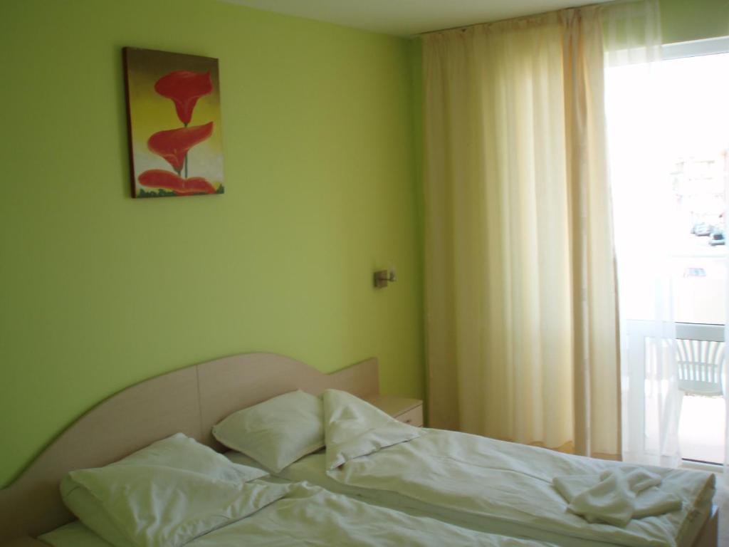 Postel nebo postele na pokoji v ubytování Niki