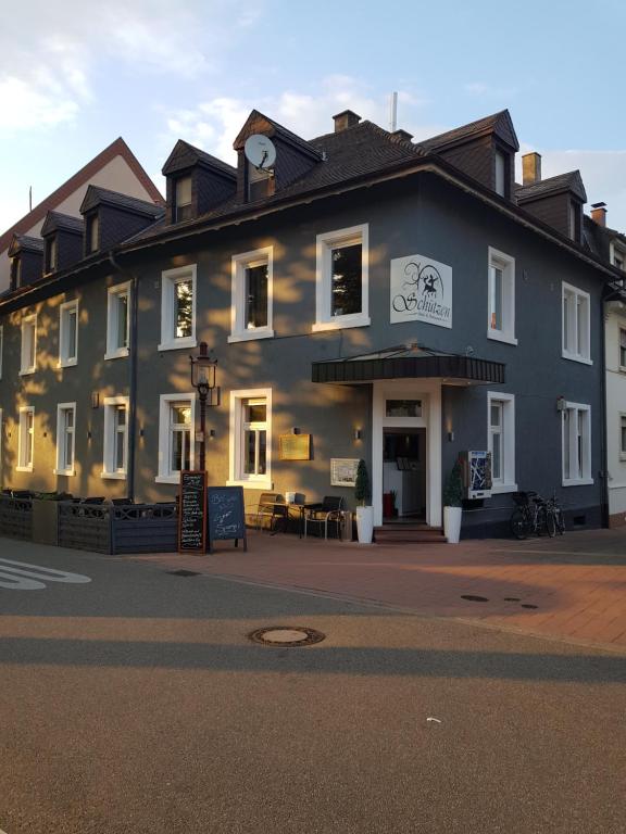 a large building with a sign in front of it at Hotel & Restaurant Schützen in Rastatt