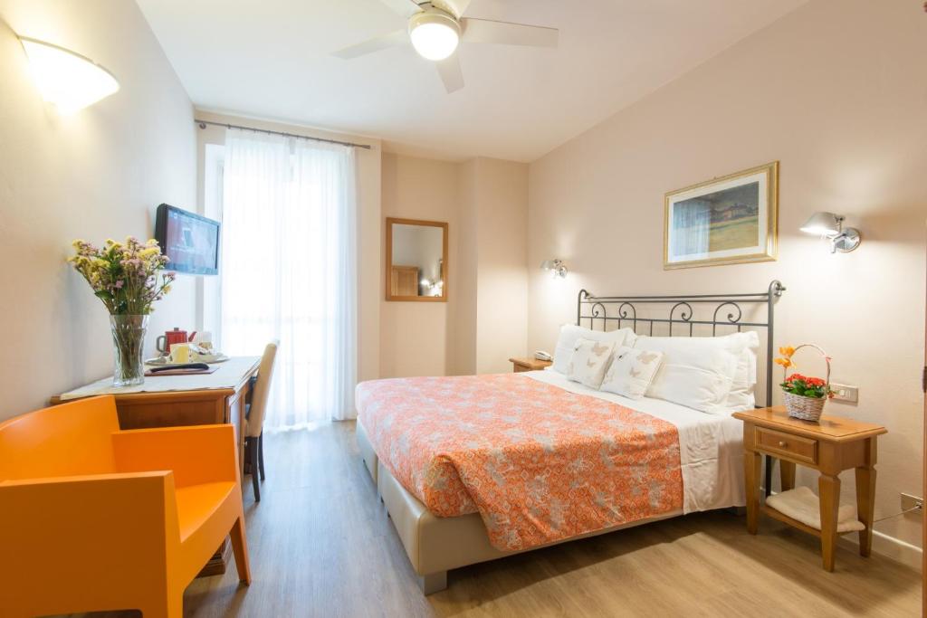 Postel nebo postele na pokoji v ubytování Hotel Antica Stallera