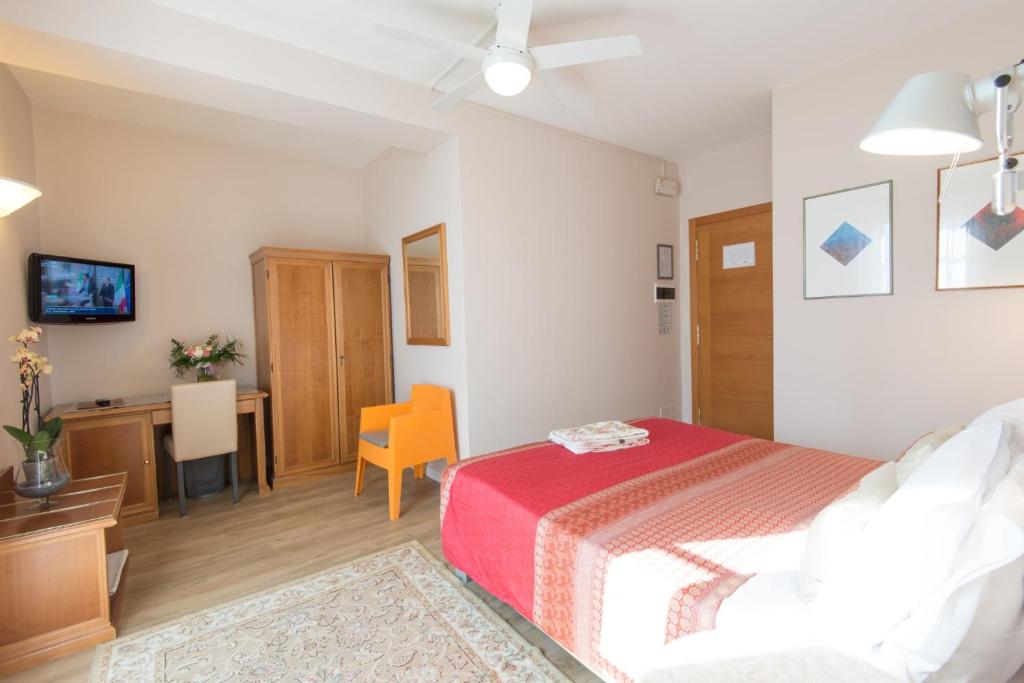 Postel nebo postele na pokoji v ubytování Hotel Antica Stallera
