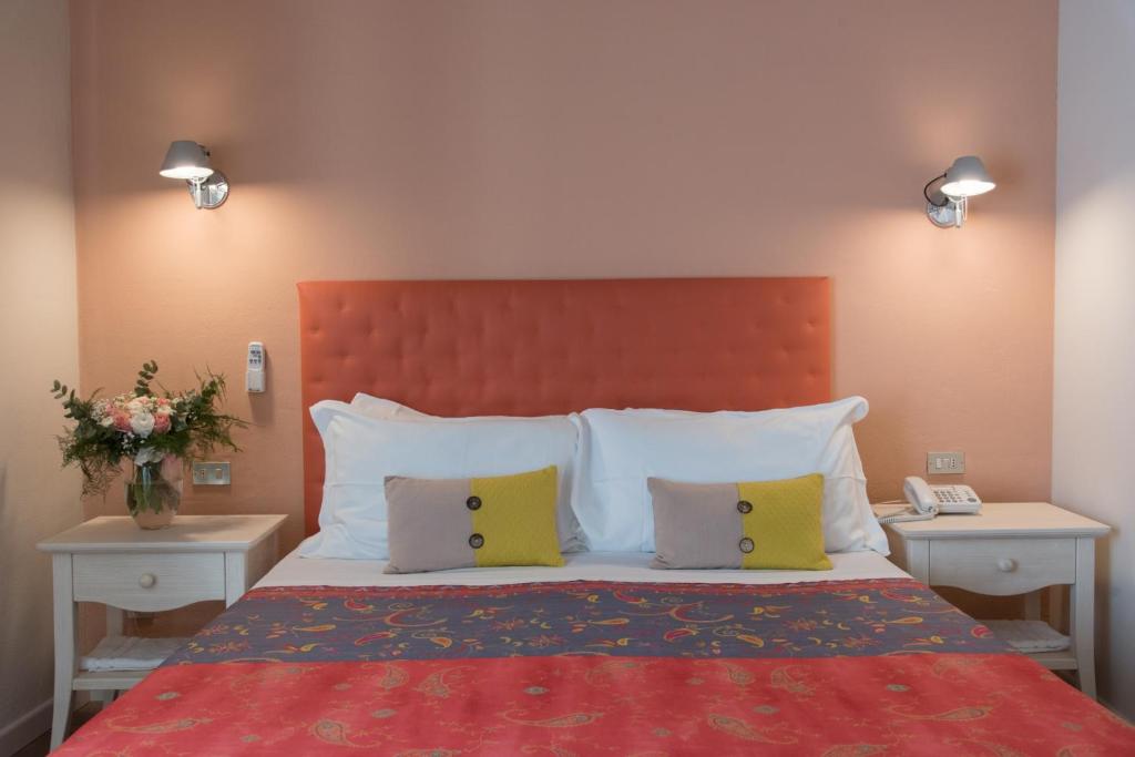 Postel nebo postele na pokoji v ubytování Hotel Antica Stallera