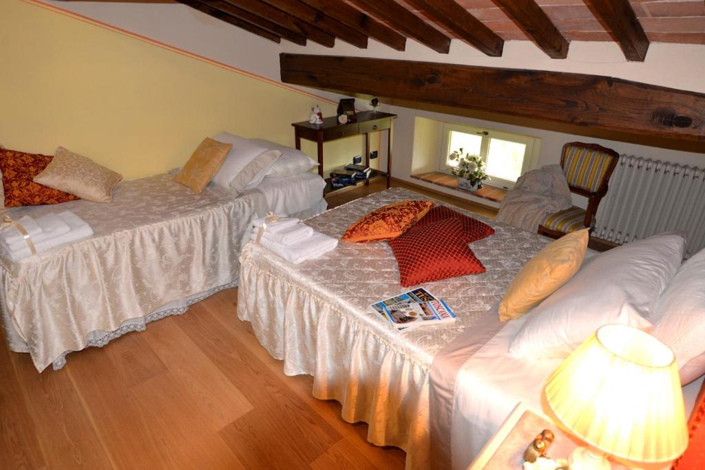 Postel nebo postele na pokoji v ubytování Borgo Ai Lecci