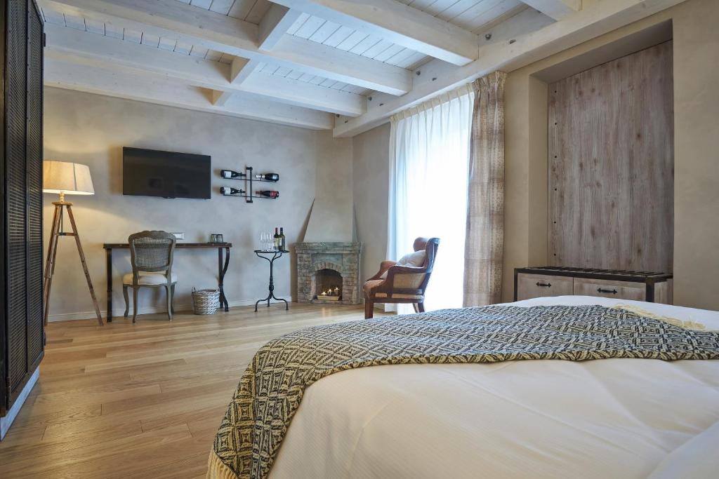 Postel nebo postele na pokoji v ubytování Relais Villa Miraglia