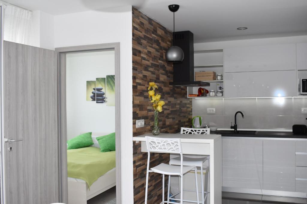 a kitchen and a bedroom with a bed at Valkane apartment in Pula