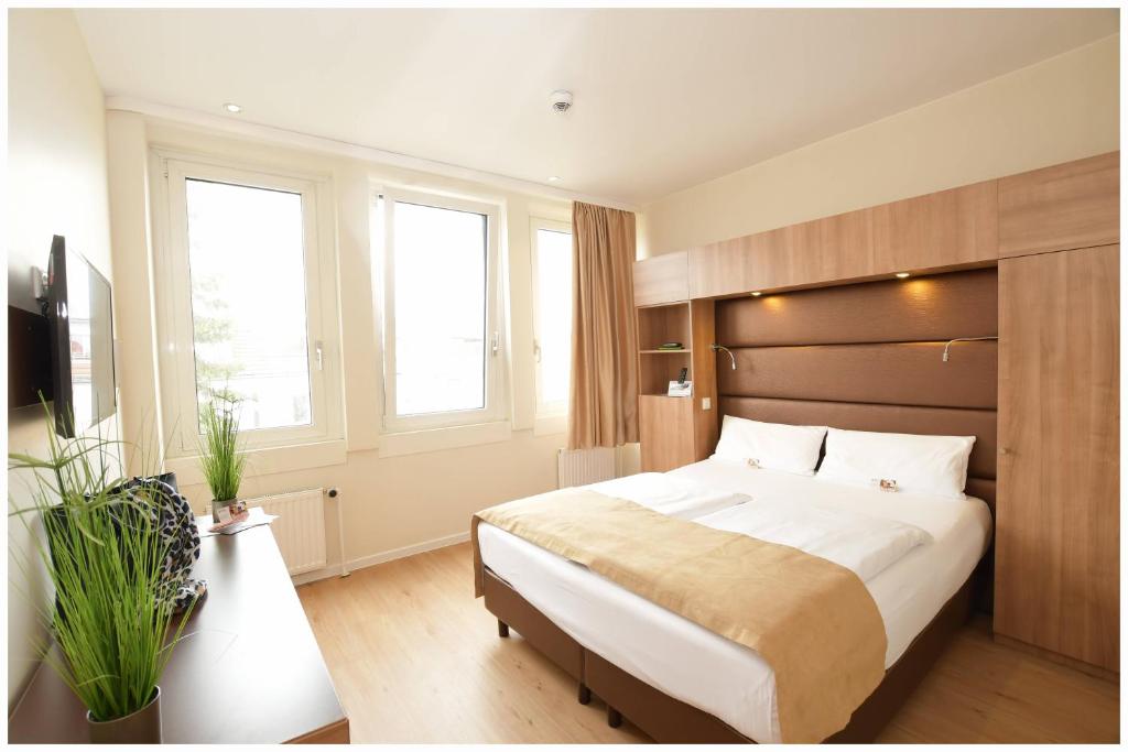 Postel nebo postele na pokoji v ubytování Motel Plus Berlin