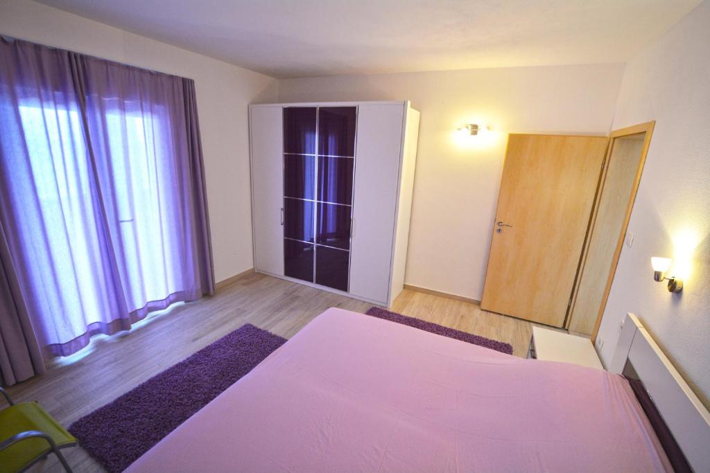 Posteľ alebo postele v izbe v ubytovaní Apartments Dubas