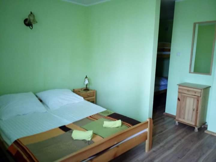 Postel nebo postele na pokoji v ubytování Zajazd Przystanek Piławki