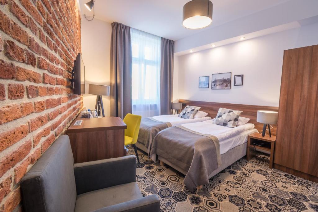 Posteľ alebo postele v izbe v ubytovaní Hotel Lavender