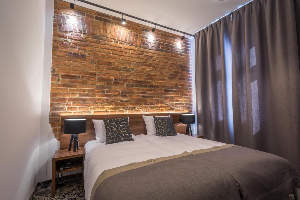 Posteľ alebo postele v izbe v ubytovaní Hotel Lavender