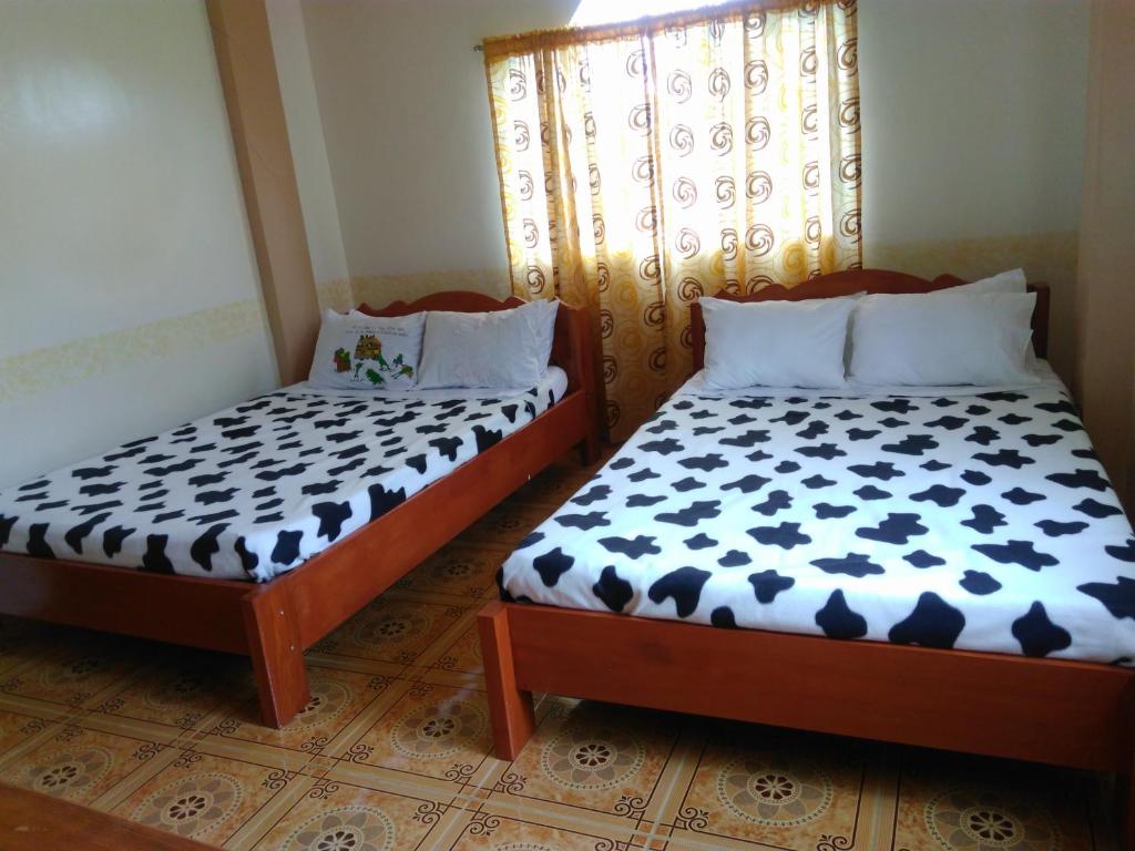 Postel nebo postele na pokoji v ubytování Savta Homestay