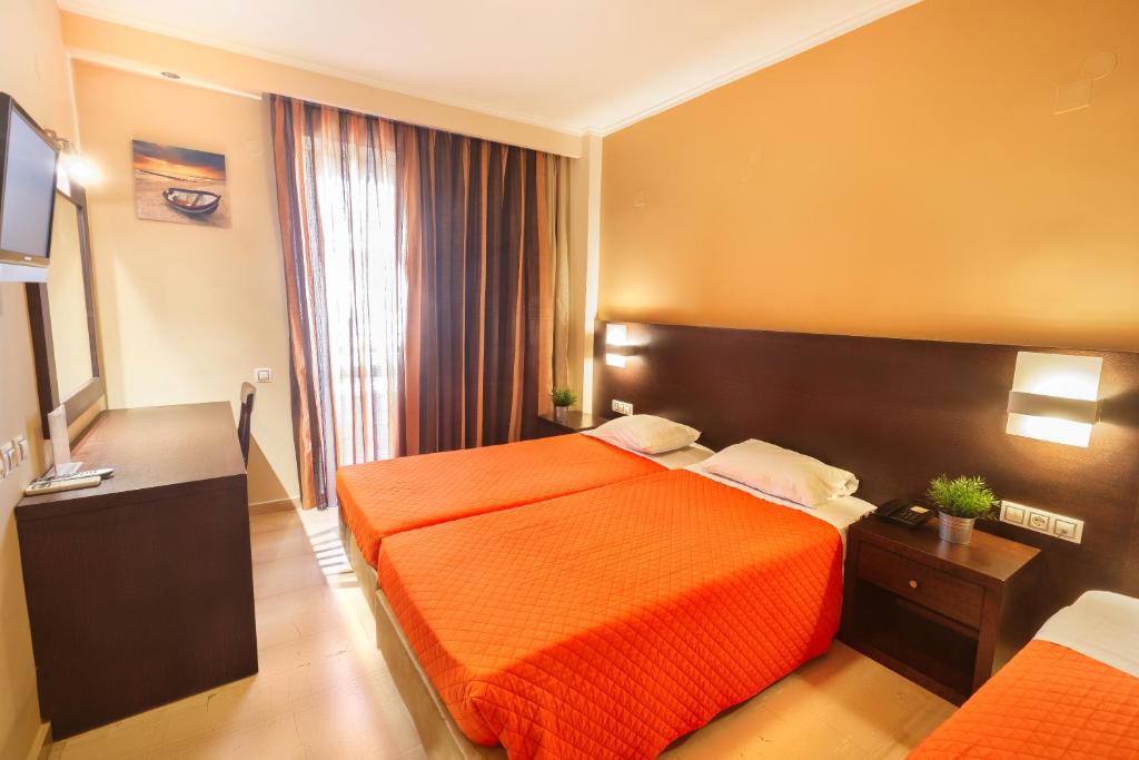 Postel nebo postele na pokoji v ubytování Sofia Hotel