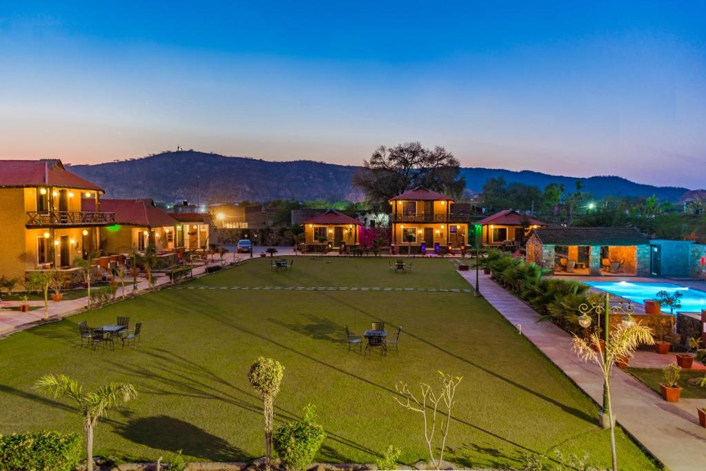 an aerial view of a large yard with a pool at Hathi Mauja in Jaipur