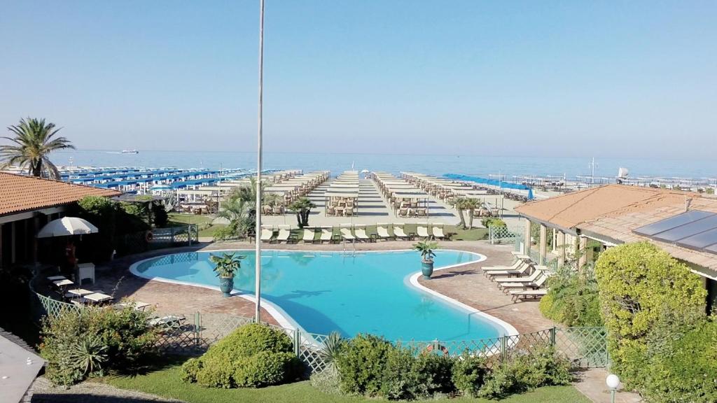 an overhead view of a swimming pool with a resort at Soleado beach house in Pietrasanta
