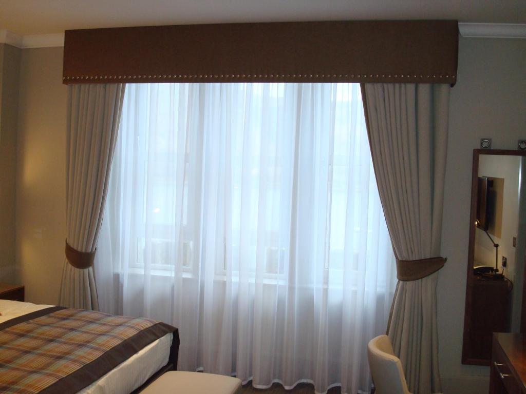 Postel nebo postele na pokoji v ubytování Cruachan Hotel