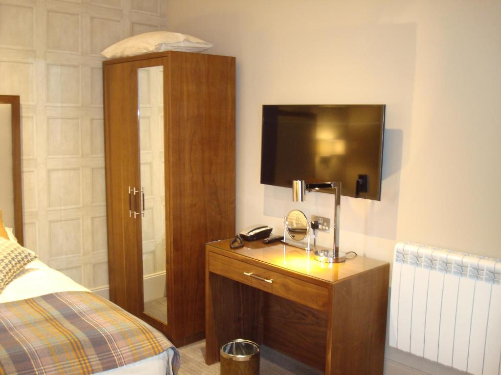 Postel nebo postele na pokoji v ubytování Cruachan Hotel