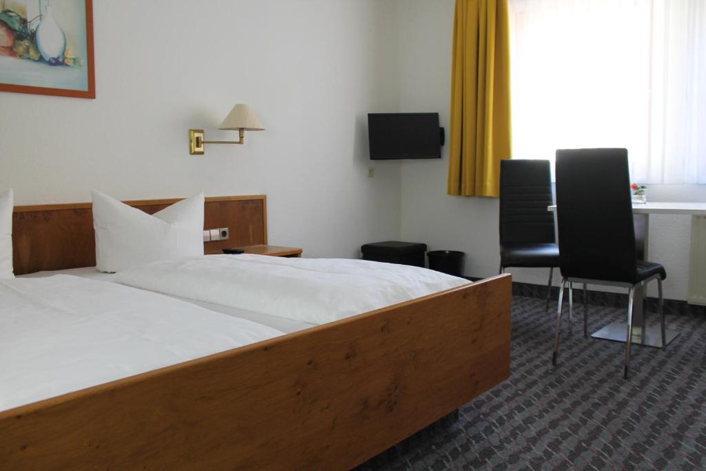 Postel nebo postele na pokoji v ubytování Hotel Sonne