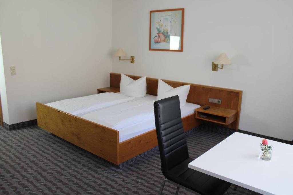 Postel nebo postele na pokoji v ubytování Hotel Sonne
