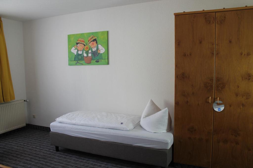 Postel nebo postele na pokoji v ubytování Hotel Sonne