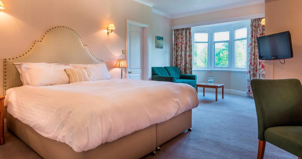 Postel nebo postele na pokoji v ubytování Petwood Hotel