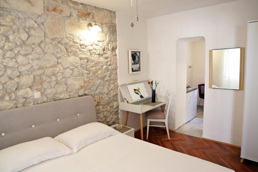 Cama ou camas em um quarto em Pinta Apartments