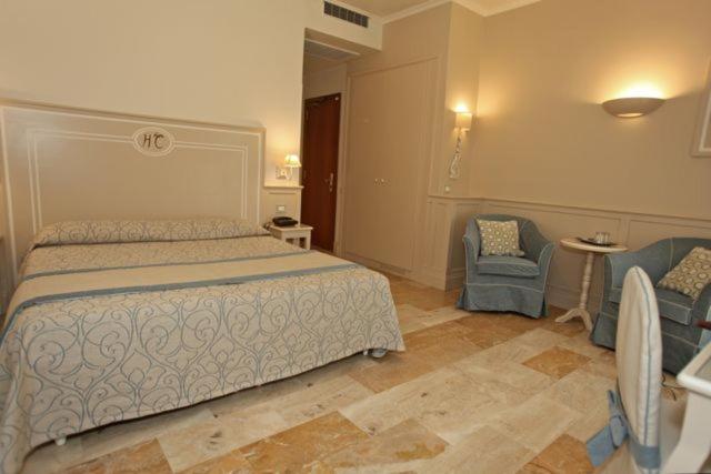 Postel nebo postele na pokoji v ubytování Hotel La Colonnina