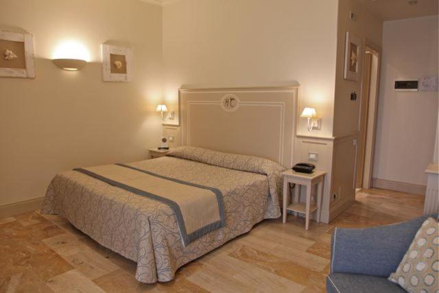 Postel nebo postele na pokoji v ubytování Hotel La Colonnina