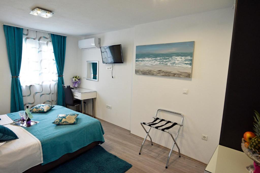 Posteľ alebo postele v izbe v ubytovaní Kuzma Rooms and Apartments