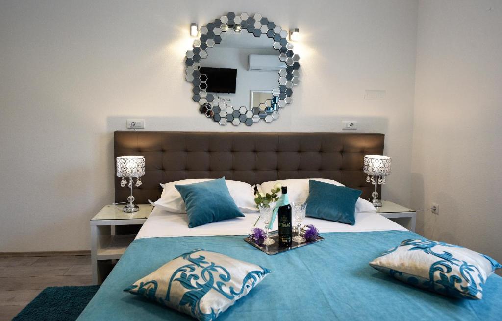 Posteľ alebo postele v izbe v ubytovaní Kuzma Rooms and Apartments