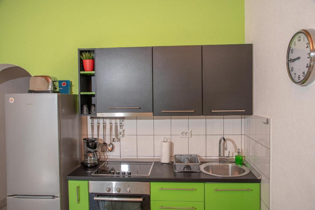 Kuchyň nebo kuchyňský kout v ubytování Apartment Ariana