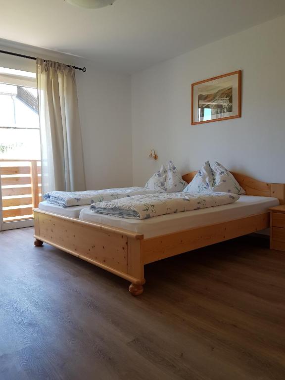A bed or beds in a room at Gasthaus St. Valentin