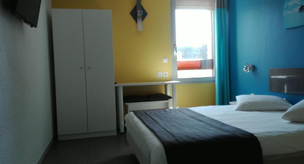 Postel nebo postele na pokoji v ubytování Beddy-bye Hôtel
