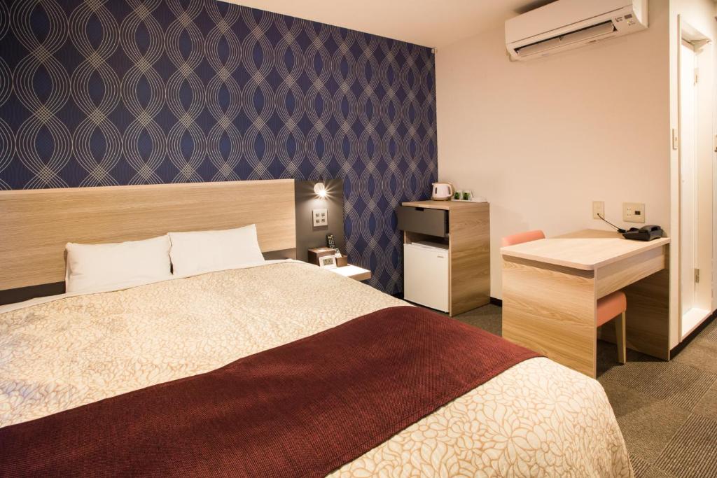 Postel nebo postele na pokoji v ubytování Kuretake Inn Premium Fujinomiya