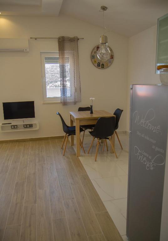 TV a/nebo společenská místnost v ubytování Apartment Punta