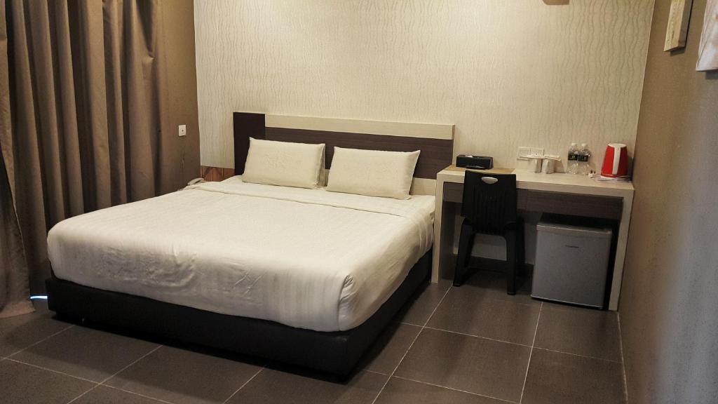 Krevet ili kreveti u jedinici u okviru objekta Kampar Boutique Hotel (Kampar Sentral)