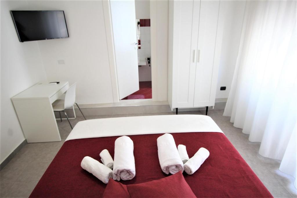 Uma cama ou camas num quarto em Mythos Affittacamere