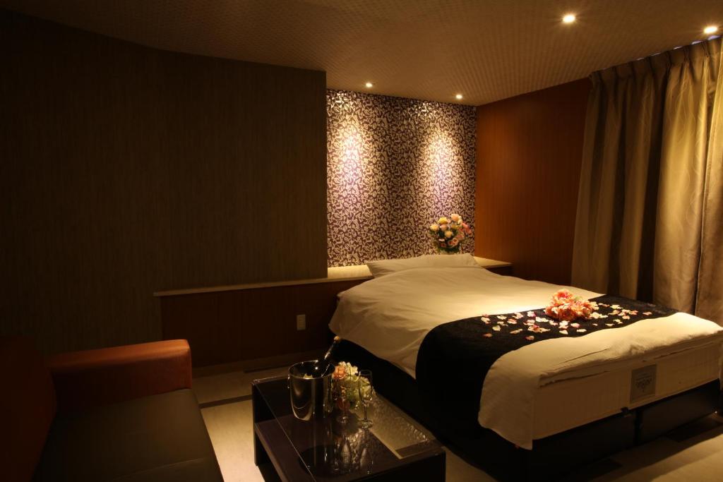 Postel nebo postele na pokoji v ubytování ホテルオリジン Hotel Origin 男塾ホテルグループ