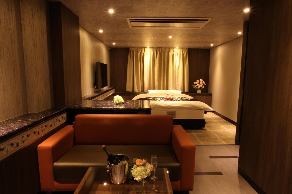 Postel nebo postele na pokoji v ubytování ホテルオリジン Hotel Origin 男塾ホテルグループ