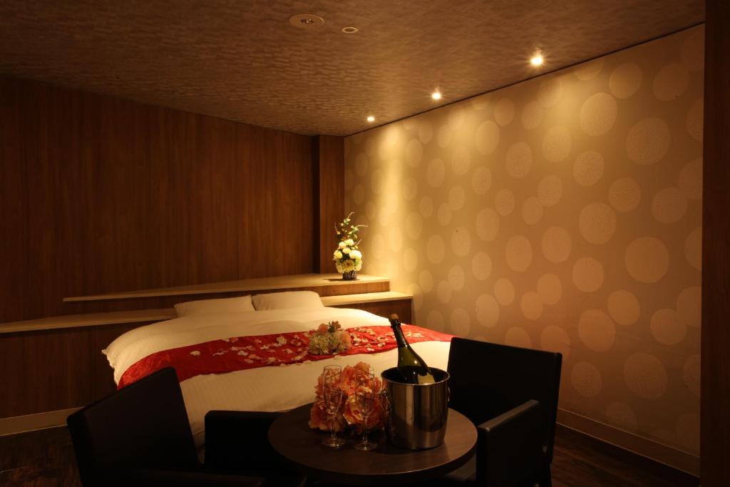 Postel nebo postele na pokoji v ubytování ホテルオリジン Hotel Origin 男塾ホテルグループ