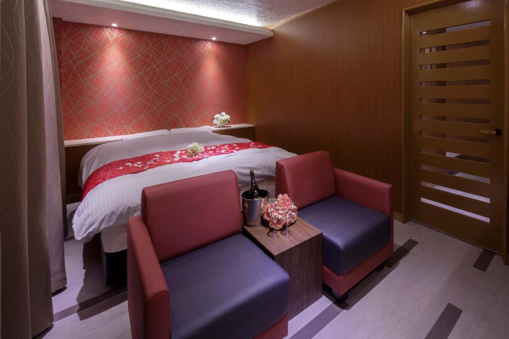Postel nebo postele na pokoji v ubytování ホテルオリジン Hotel Origin 男塾ホテルグループ