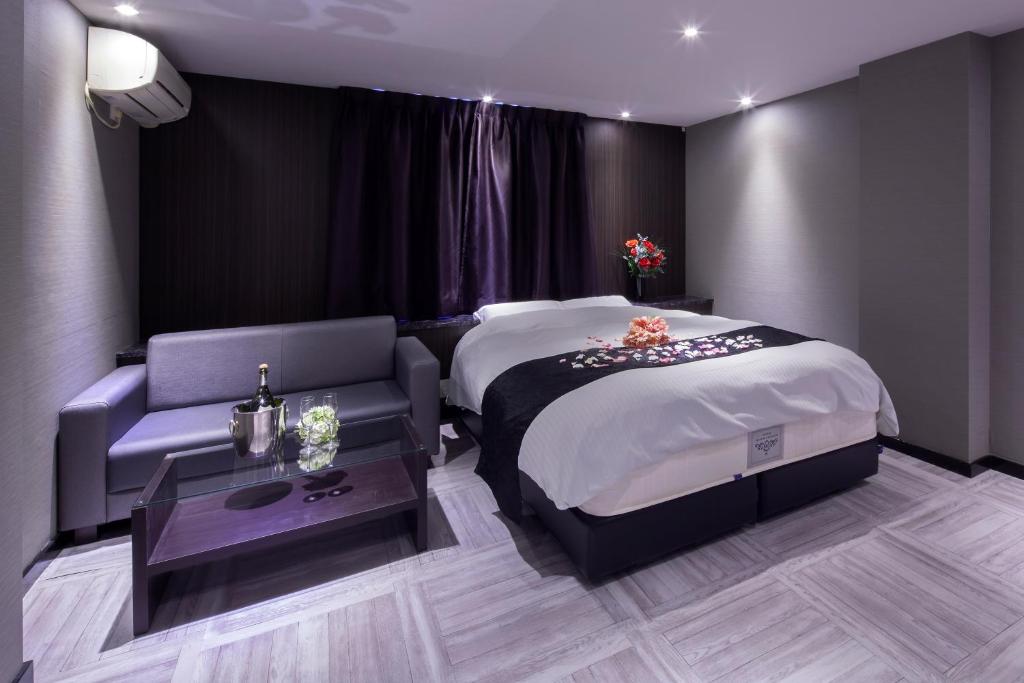 Postel nebo postele na pokoji v ubytování ホテルオリジン Hotel Origin 男塾ホテルグループ