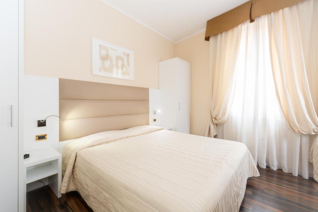 Postel nebo postele na pokoji v ubytování Hotel University
