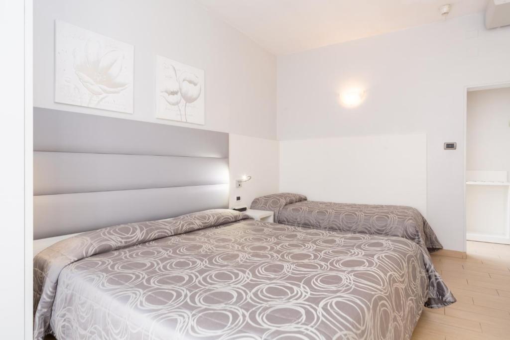 Postel nebo postele na pokoji v ubytování Hotel University